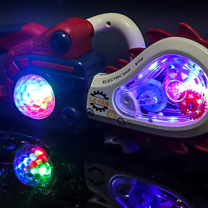 Red toy saw with multicolor lights glowing through its clear panel and round side light