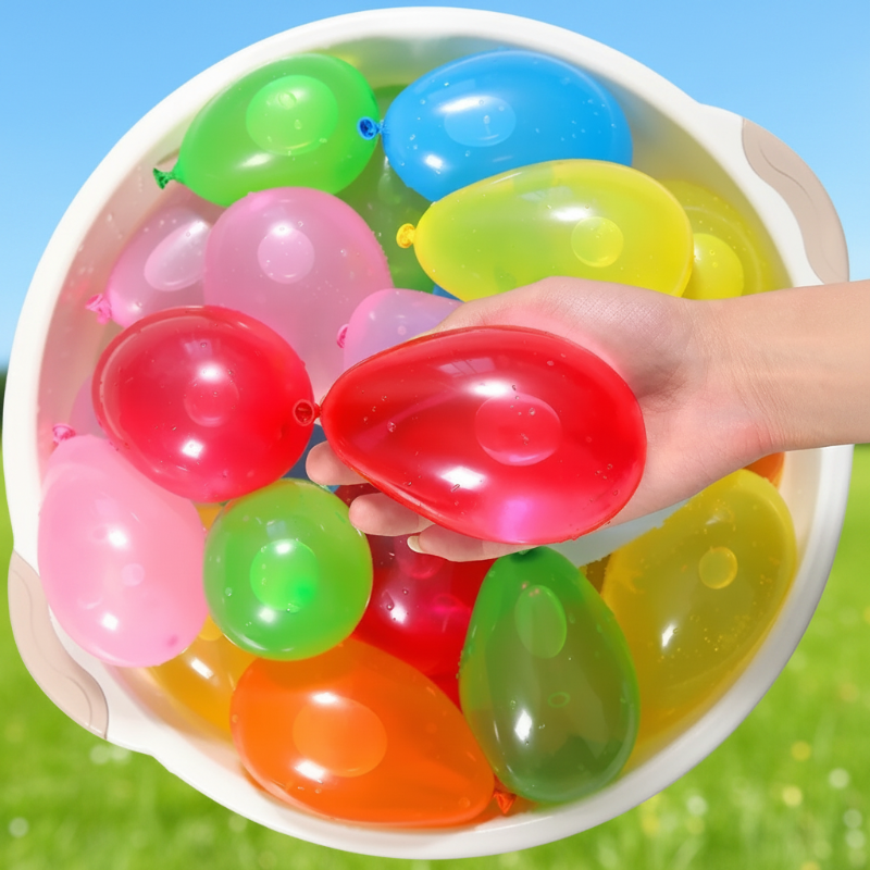 Hand holding red water balloons above a bowl of assorted colors