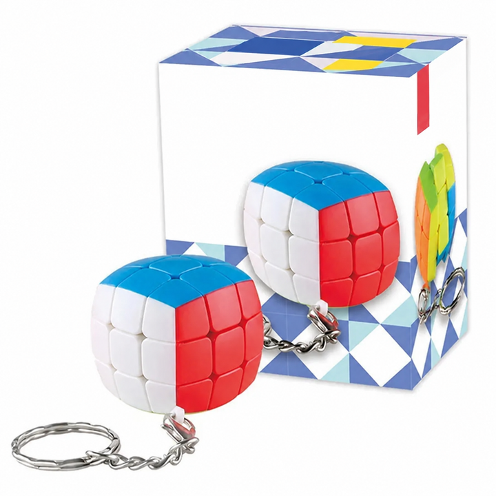 Rounded red, white, and blue cube puzzle with an attached key ring beside its box