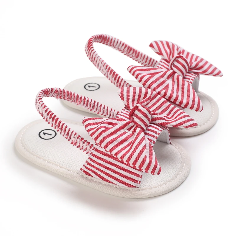 Red-and-white striped bow baby sandals with matching elastic heel straps