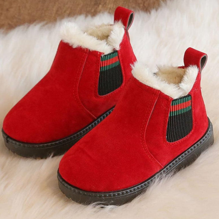 Red winter boot pair showing suede uppers, cream plush collars, and heel pull loops.
