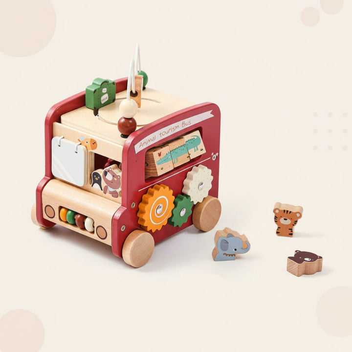 Red wooden activity bus with colorful gears and three animal-shaped blocks