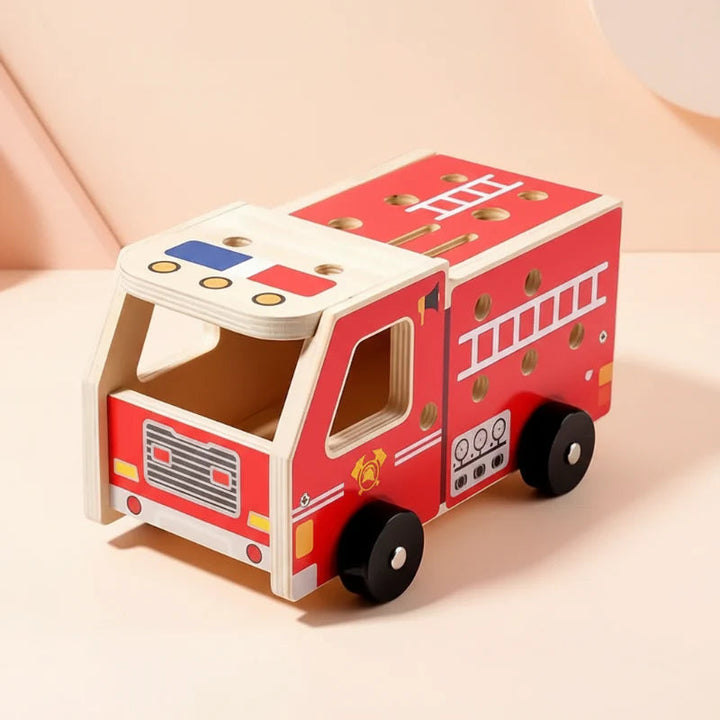 Red wooden fire truck body with black wheels and printed ladder details.