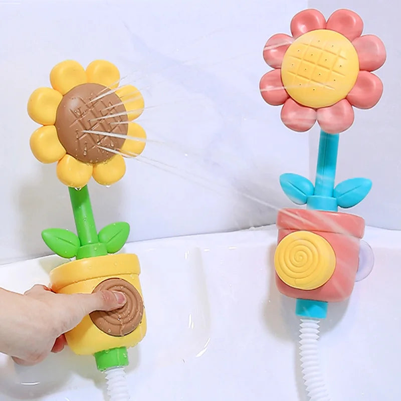 Red and yellow flower bath sprayers mounted on a tub while a hand presses the yellow sprayer