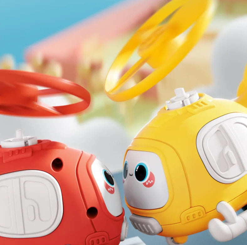 Red and yellow cartoon helicopter toys with spinning rotor discs above them
