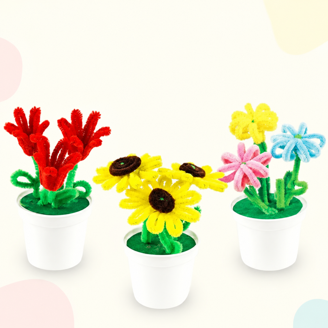 Three white pots with red, yellow, pink, and blue fuzzy-wire flowers