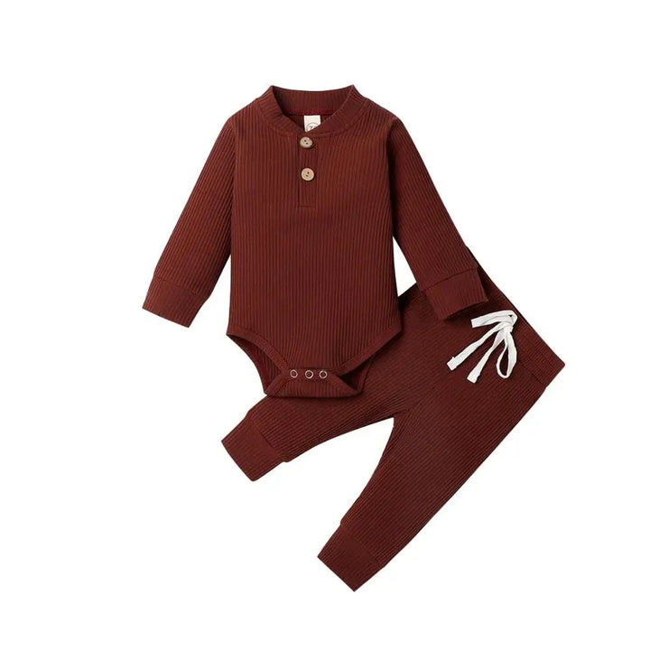 Reddish-brown ribbed baby bodysuit and matching pants with a white waist tie
