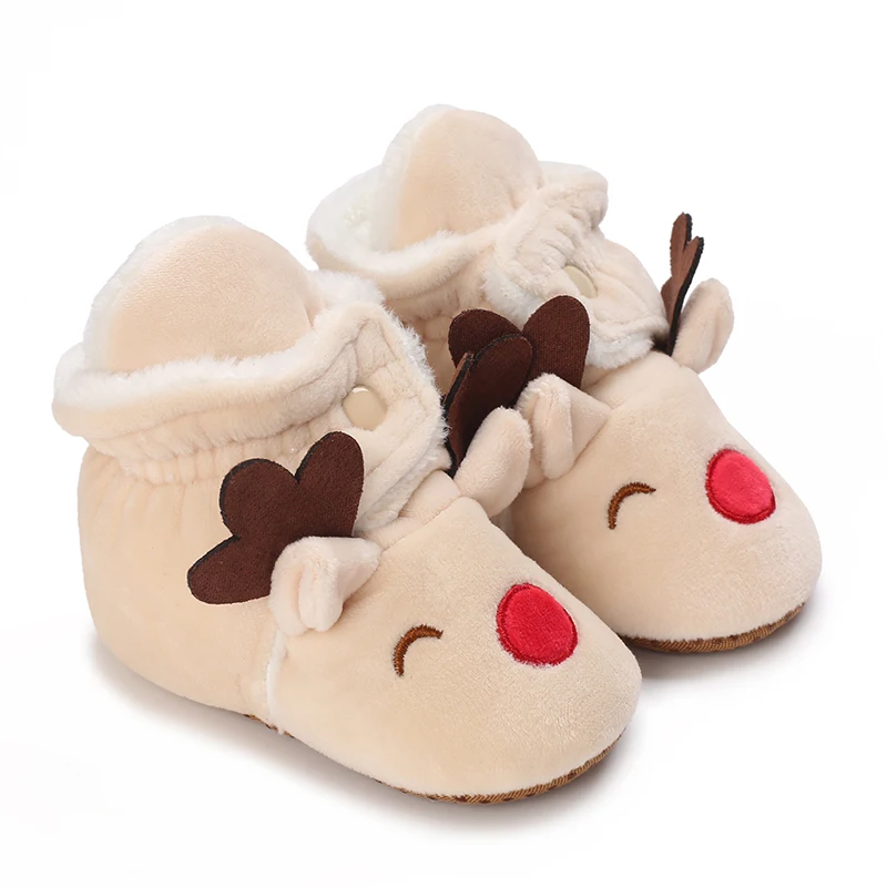 Cream reindeer baby boots with brown antlers, red noses and plush-lined openings