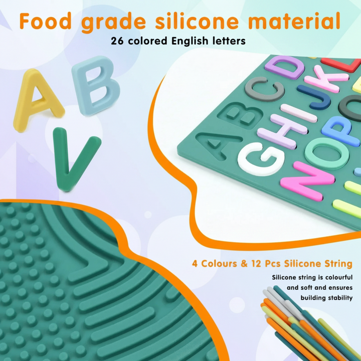 Close-up of removable alphabet letters, a green textured board, and colored silicone strings