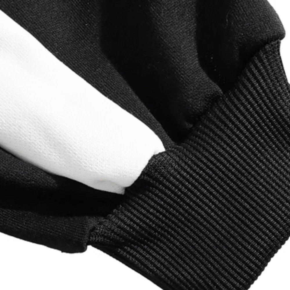 Close-up of a ribbed black cuff beside the sweater&