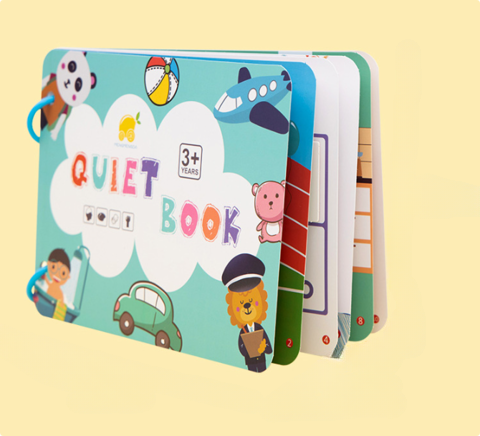 Ring-bound activity book standing partly open with an illustrated turquoise cover and colorful pages