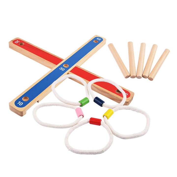Two crossed wooden base pieces, five loose pegs, and five rings for the ring toss game.
