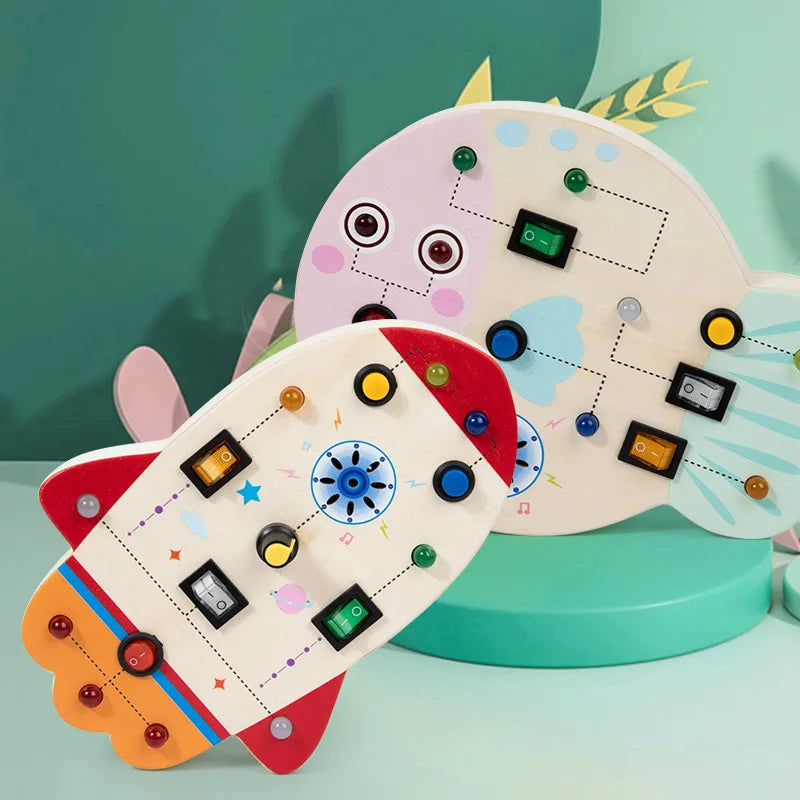 Rocket and fish activity boards with colorful buttons and switches