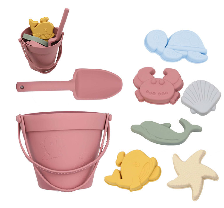 Rose-colored silicone beach bucket and shovel with six colorful sea-themed molds.