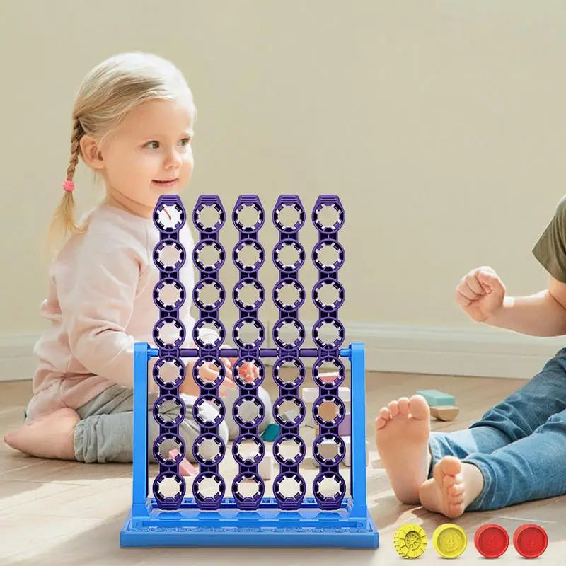 Rotating-column game set up between two children with red and yellow discs beside the base.