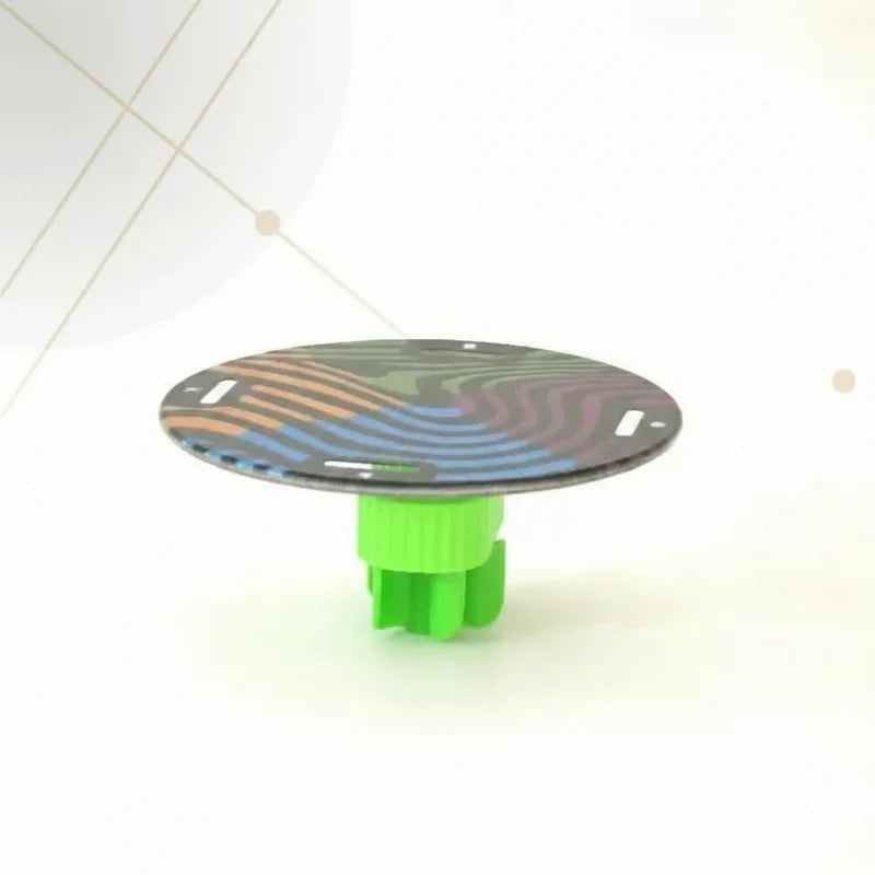 Round multicolored balancing platform resting on a green support.