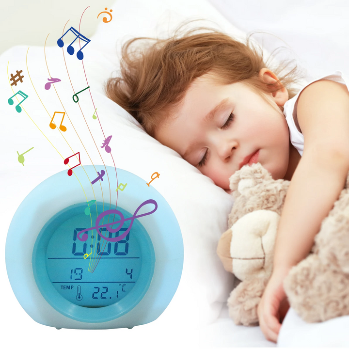 Round blue-trim alarm clock beside a sleeping child with musical note graphics.