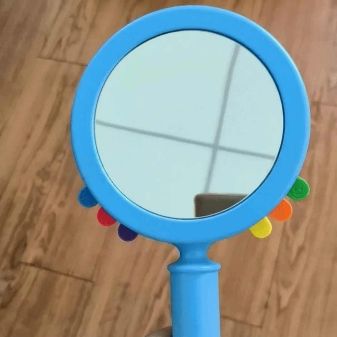 Close-up of the round blue mirror with multicolored card tabs