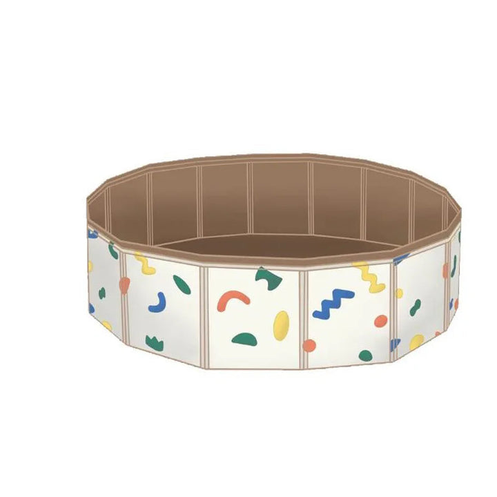 Empty round play pool with a beige interior and colorful abstract shapes on the sides