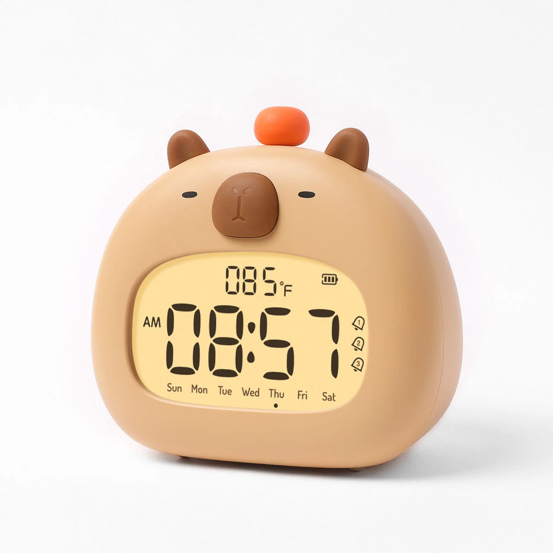 Rounded beige capybara alarm clock with an orange top button and a large digital display.