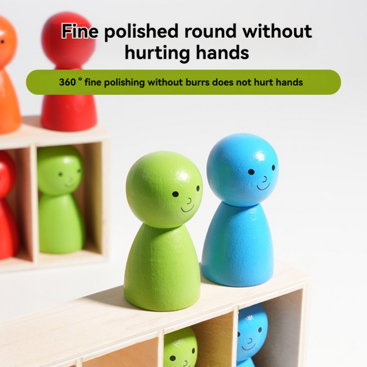 Green and blue wooden figures with rounded heads beside a compartmented rack