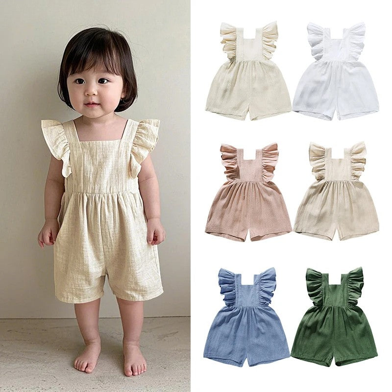 Child wearing a cream ruffled baby romper beside six available color options.