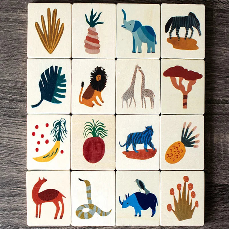 Sixteen wooden tile designs in a grid, including an elephant, lion, giraffes, and plants
