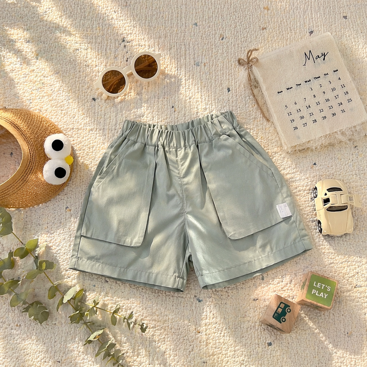 Sage green pull-on shorts with an elastic waist and roomy front patch pockets.