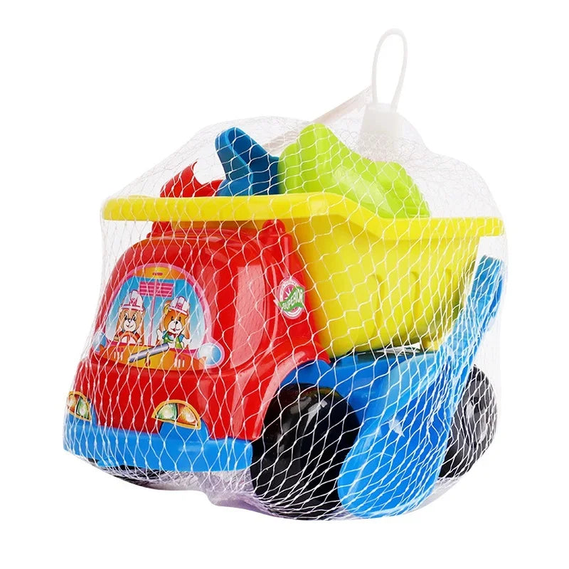 Colorful toy dump truck and sand accessories packed in a white mesh bag.