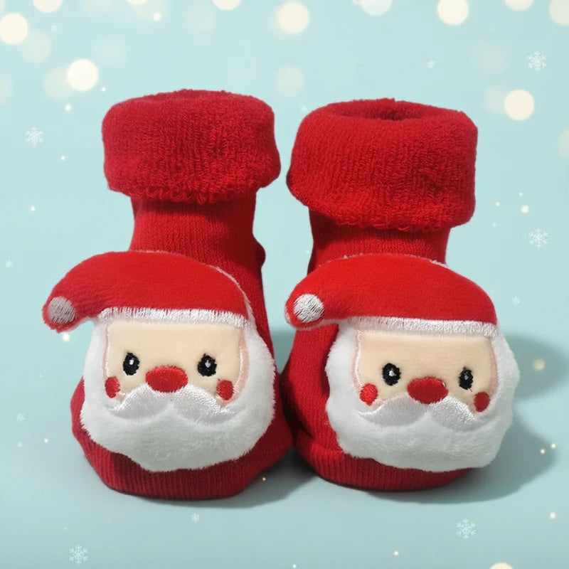 Red baby socks with Santa faces, white beards and thick folded cuffs