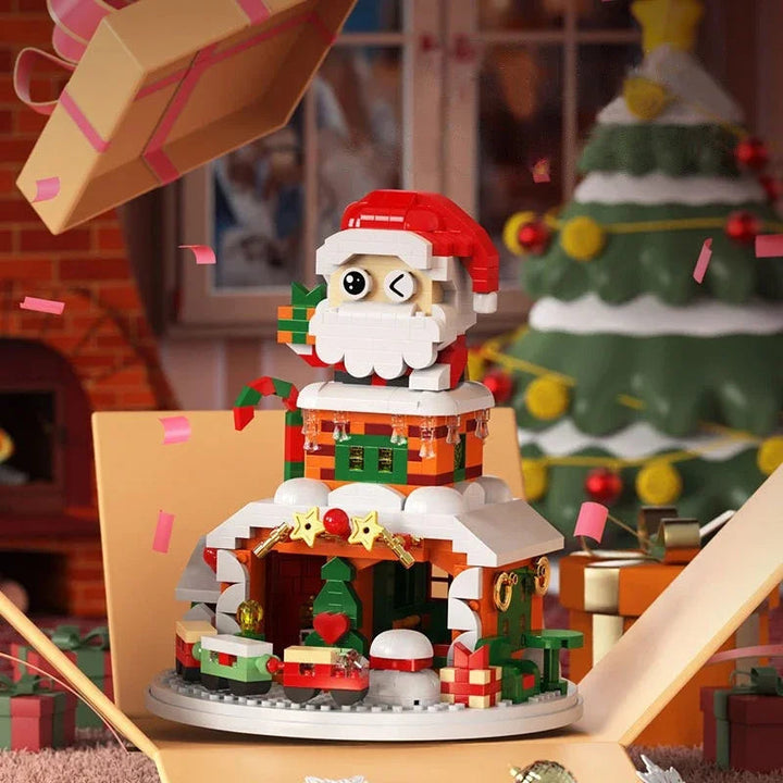 Santa-topped Christmas block house on a round base with snow details