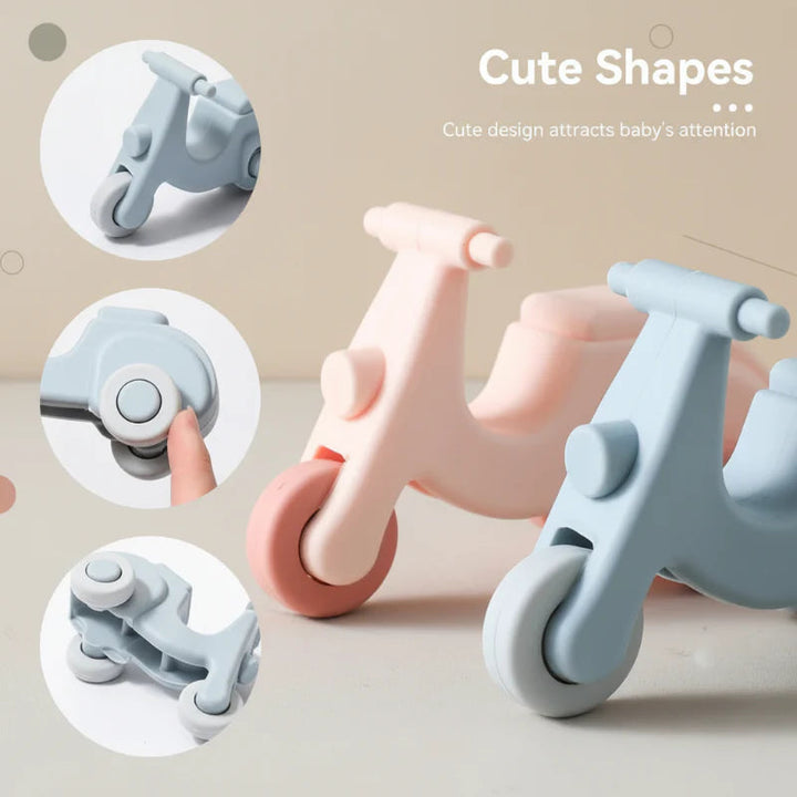 Pink and blue scooter teethers with close-up views of the body, wheel and underside