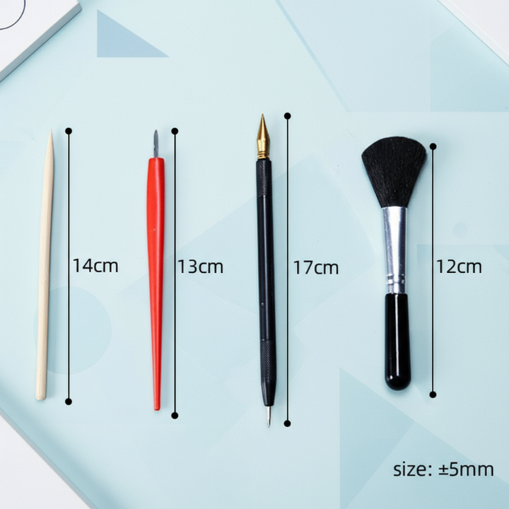 Four scratch-art tools: a wooden stylus, red stylus, black-handled pointed tool, and brush