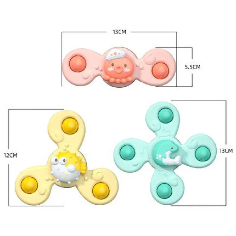 Size chart showing a 12 cm yellow spinner, 13 cm mint-green spinner and 13 x 5.5 cm pink spinner