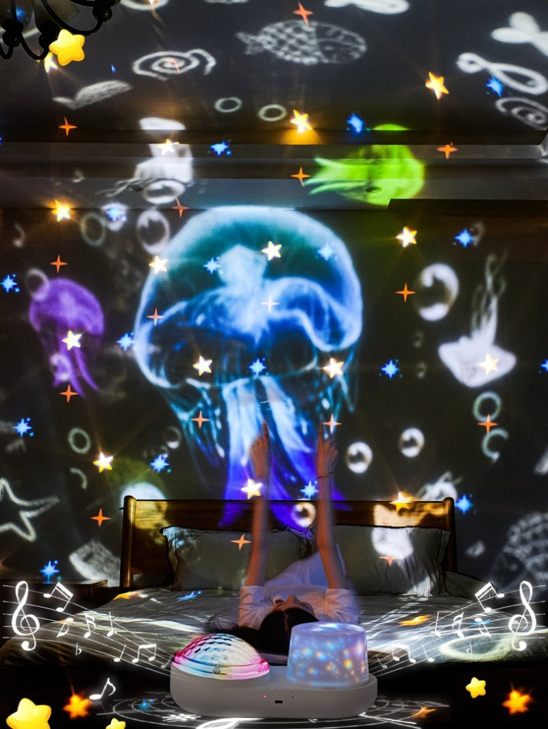 Dual-lens projector displaying jellyfish, bubbles, stars, and sea-themed shapes around a room.