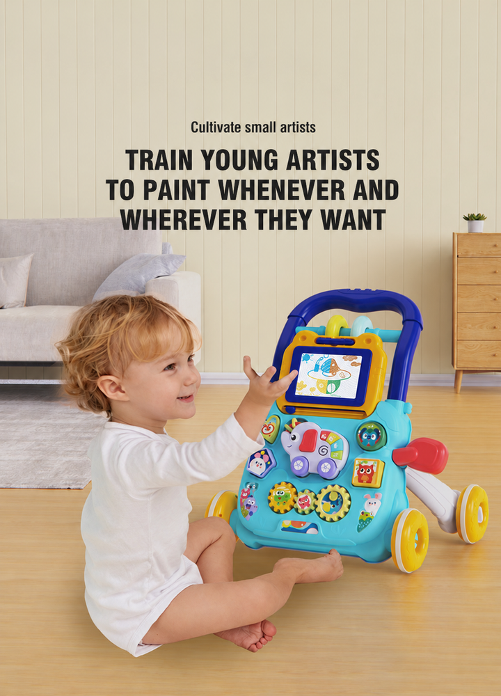 Child seated beside the blue push walker and reaching toward the drawing board