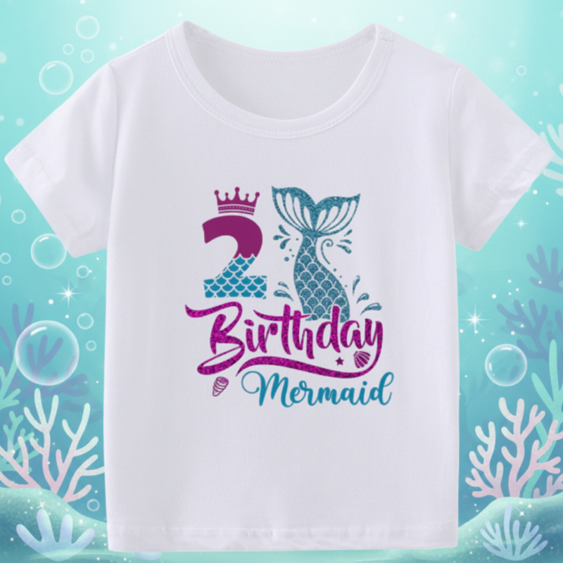 White second-birthday T-shirt with a purple number 2, crown, and teal mermaid tail