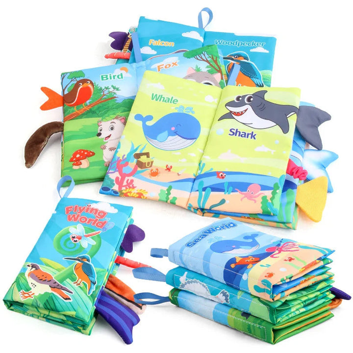 Animal-themed fabric books with a whale-and-shark spread, colorful tabs, and stacked designs.