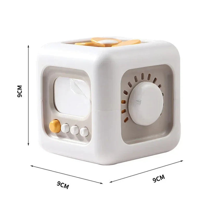 Sensory cube with a mirror panel and turning dial, labeled 9 cm on each side