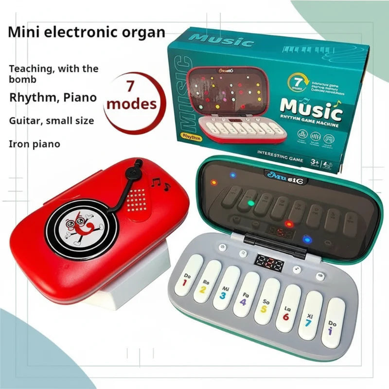 Red and green piano toys with numbered keys, a colored light panel and retail packaging