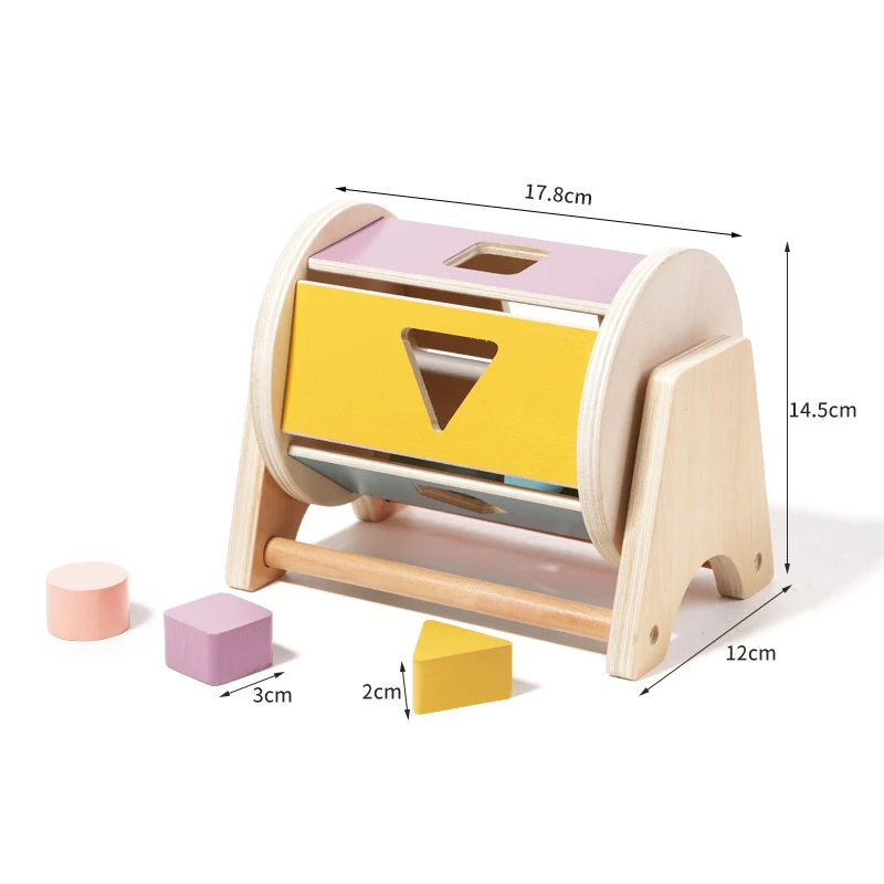 Wooden shape-sorting drum with blocks and measurements of 17.8 cm wide, 12 cm deep and 14.5 cm high