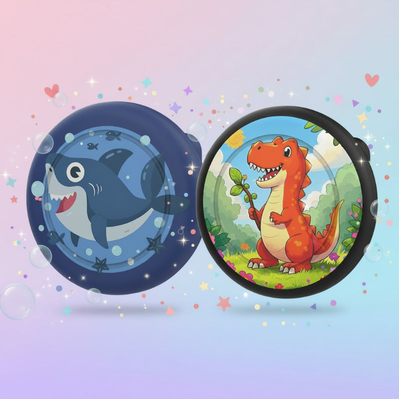 Dark blue shark and black-rimmed dinosaur AirTag brooch cases displayed side by side