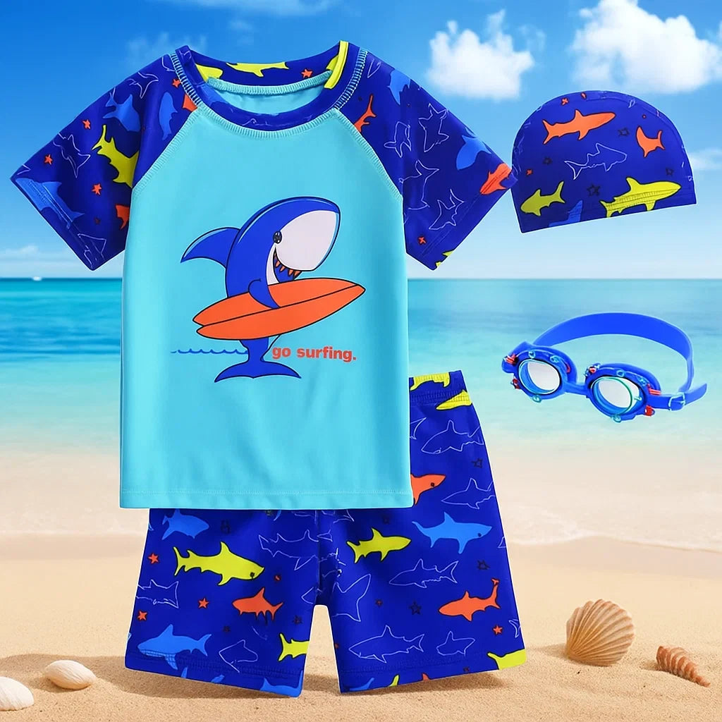 Shark-print swim shirt and shorts displayed with a matching cap and blue goggles