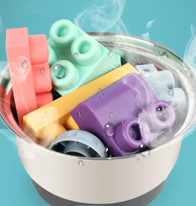 Colorful silicone blocks and wheels shown in a steaming pot