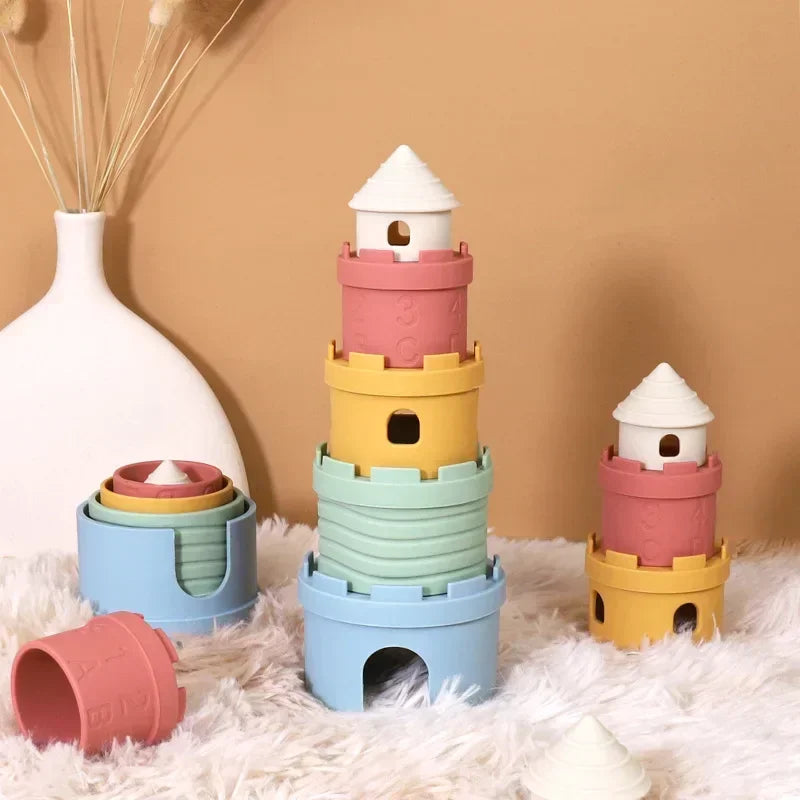 Silicone castle pieces arranged as tall and short towers beside a nested stack