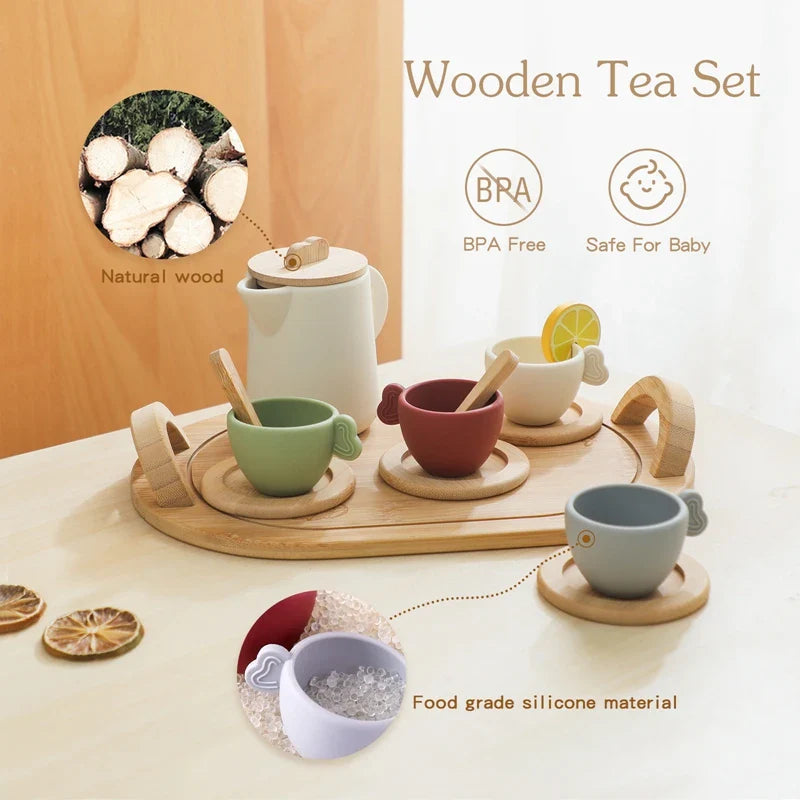 Silicone teapot and colored cups displayed with wooden accessories and a serving tray