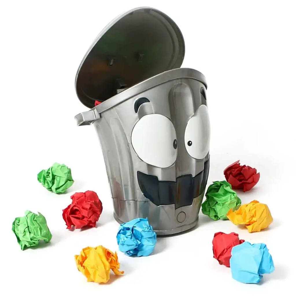 Gray cartoon trash can target with its lid open and colorful crumpled paper balls.