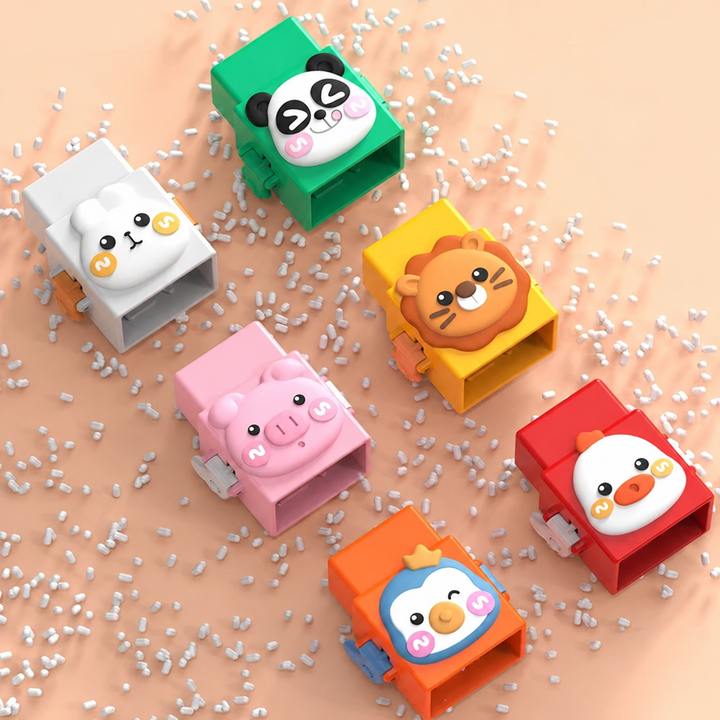 Six animal blocks on a peach-colored surface, including a panda, pig, lion, and penguin.