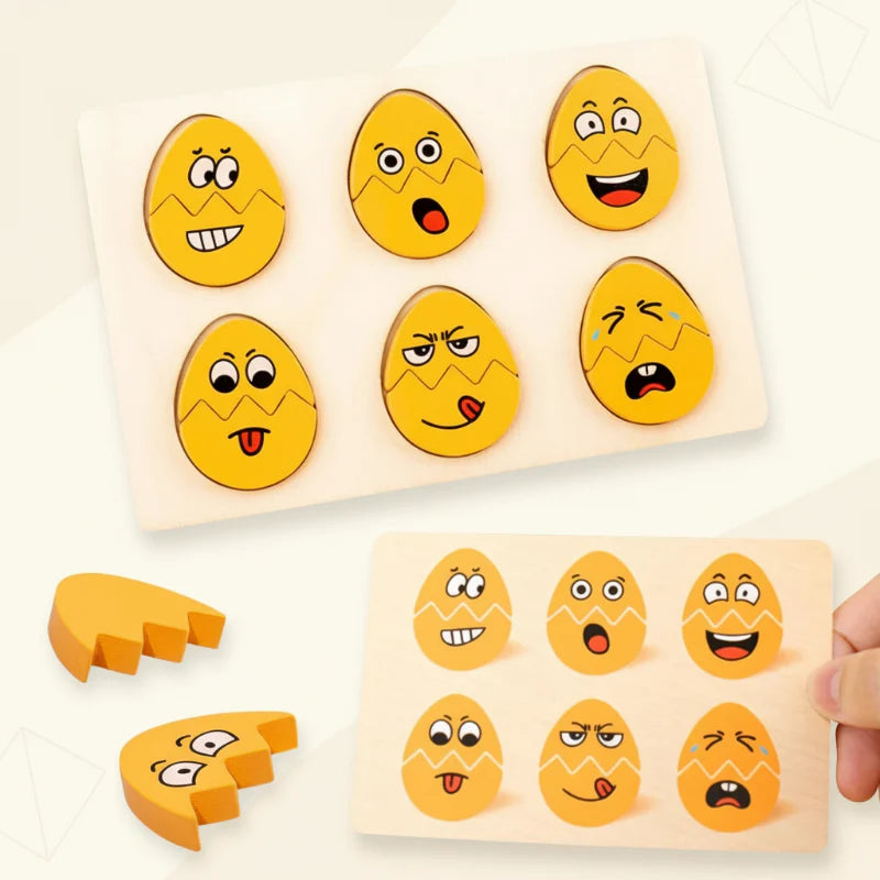 Six completed wooden egg faces on a board beside a card showing the same expressions