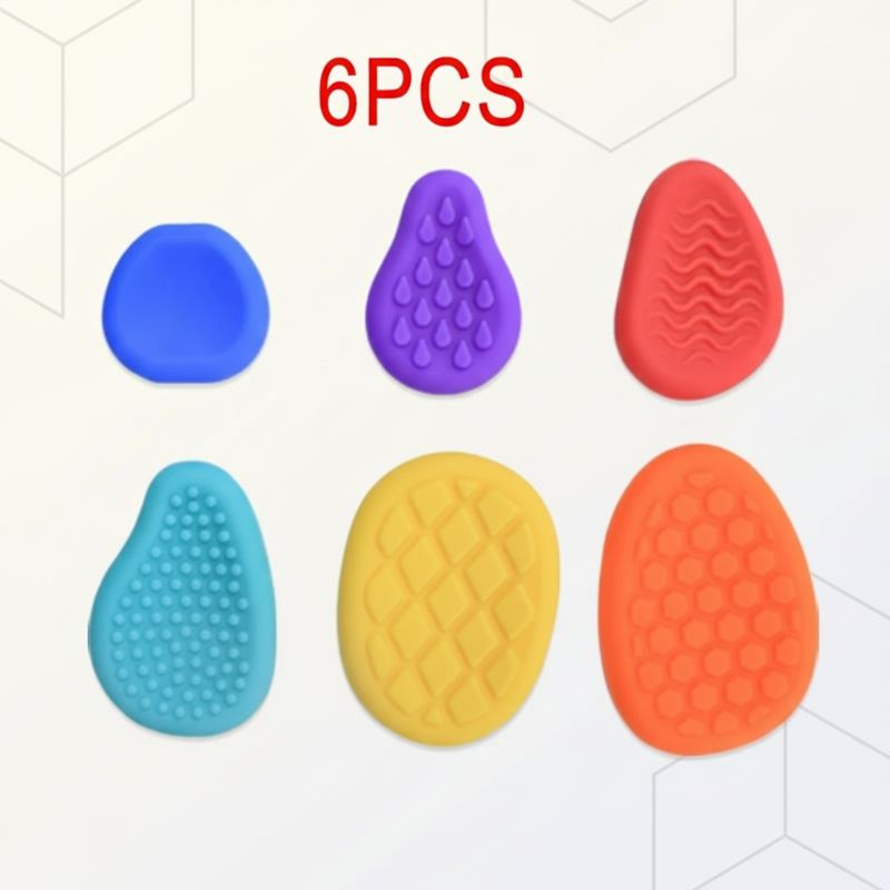 Six colorful silicone fidget stones with dimpled, ridged, and raised-pattern surfaces